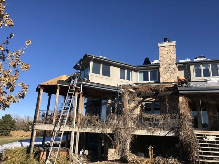 Contractors replacing roof in Greenwood Village Colorado