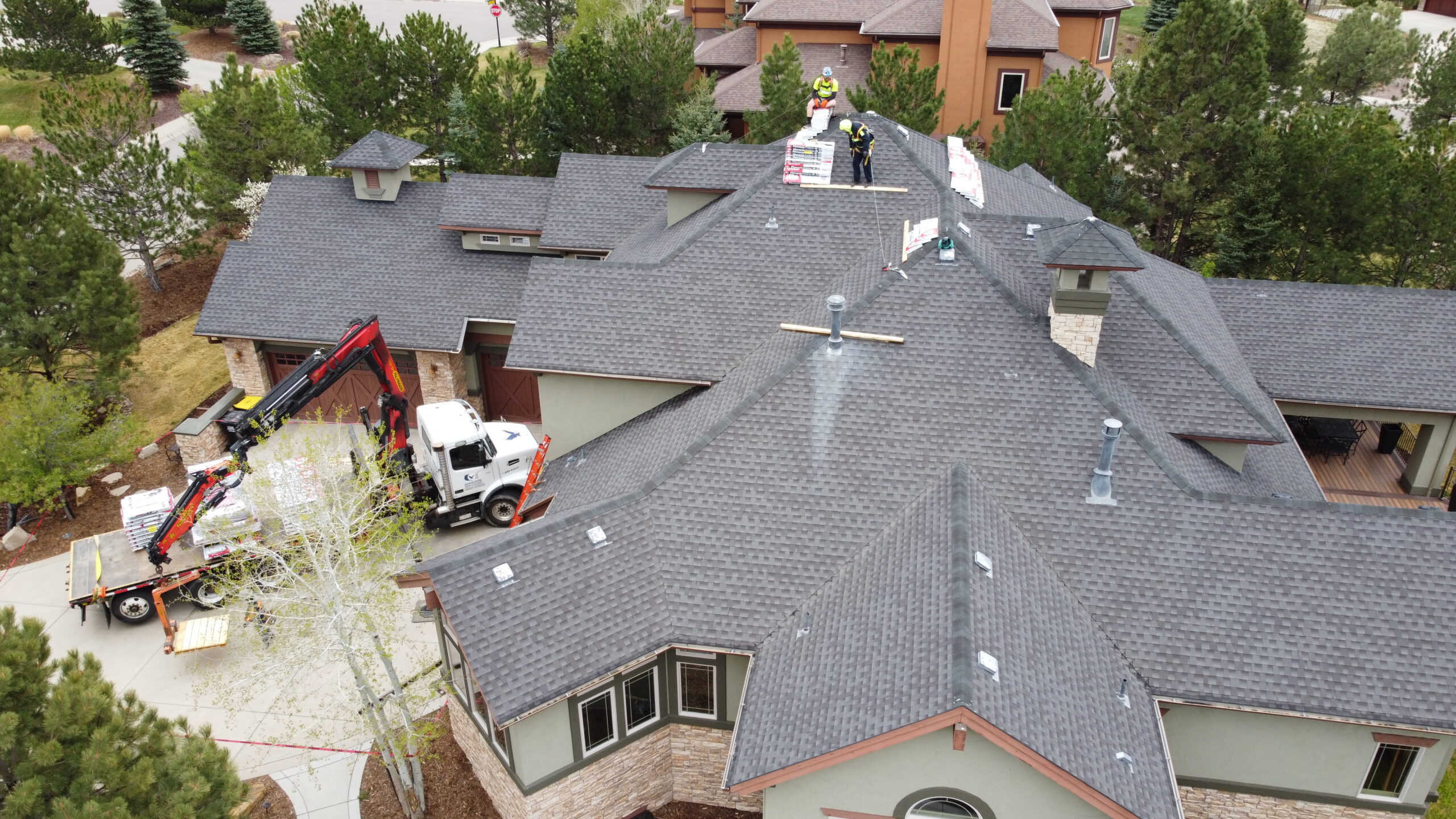 Contractors Replacing hail Damaged Roof in Denver Colorado