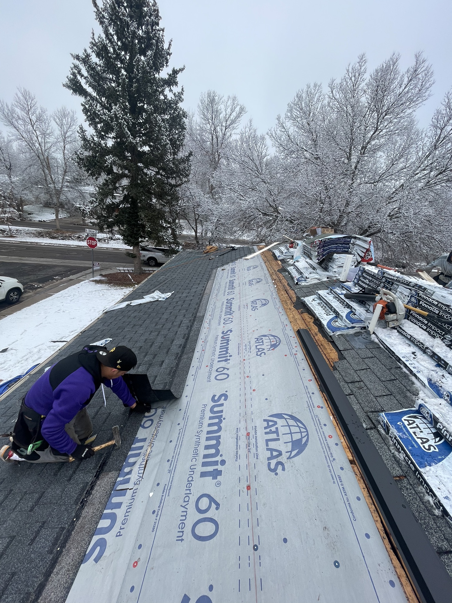 Hail damaged roof replacement in progress